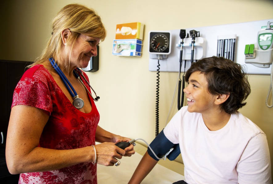 Small child having blood pressure measured